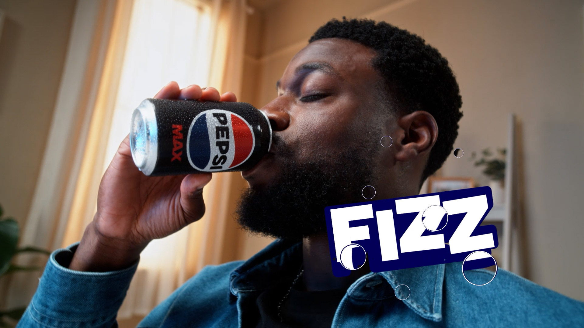 Man drinking from Pepsi can with animated ‘Fizz’ text in vibrant beverage commercial produced by our motion design studio