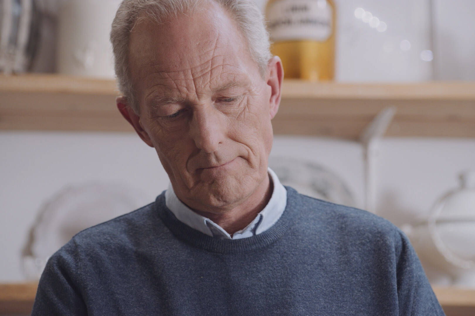 Close-up portrait of man using Philips nebuliser respiratory device, showcasing focused expression in high-quality healthcare video