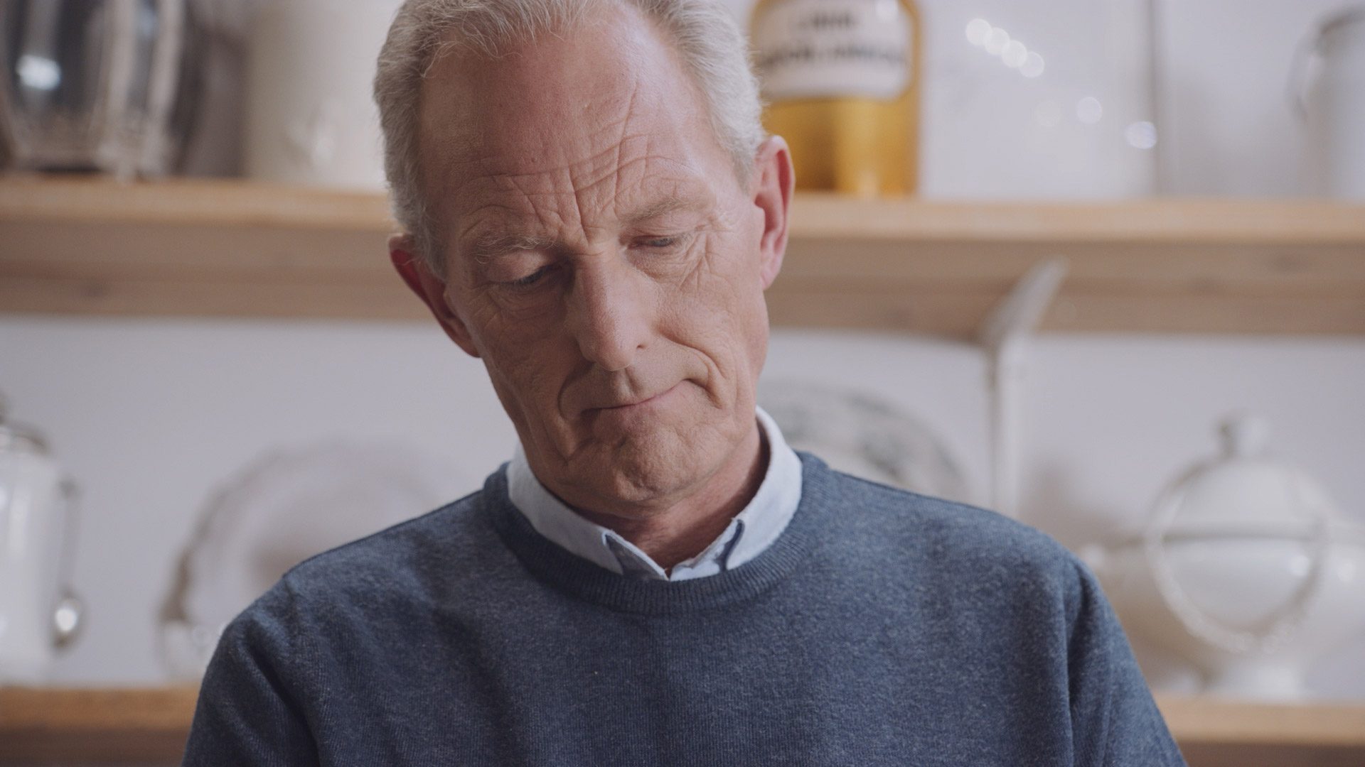 Close-up portrait of man using Philips nebuliser respiratory device, showcasing focused expression in high-quality healthcare video